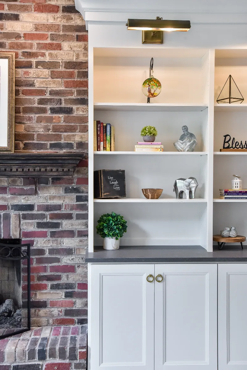 A transitional-warm living room in Brentwood, TN connected to a full kitchen remodel. Dark Walnut stained hardwood floors and warm material continuity by Sebring Design Build.