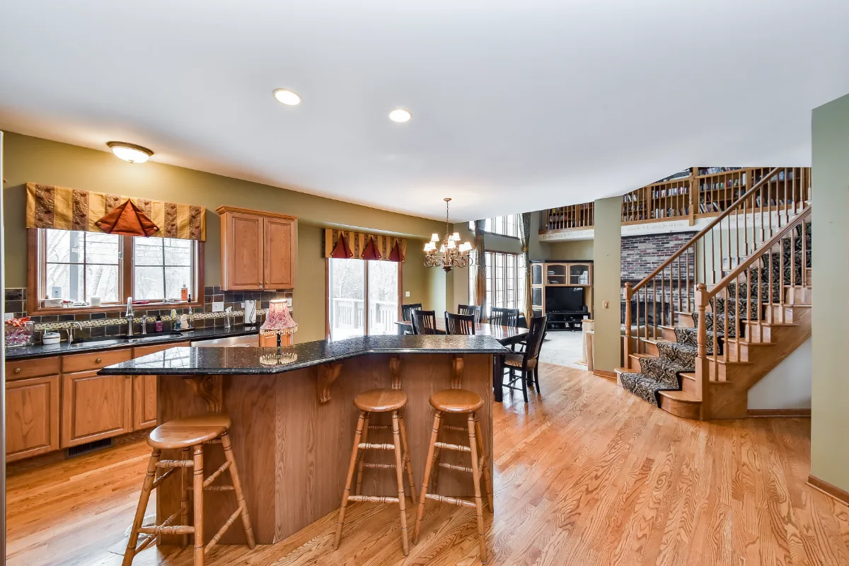A transitional-warm kitchen in Brentwood, TN. CWP Snowbound and Urban Bronze Beaded Inset cabinetry, Orion Calacatta Aria quartz, Black Walnut end-grain island top, and Sonoma Stellar Metro Gray backsplash by Sebring Design Build.