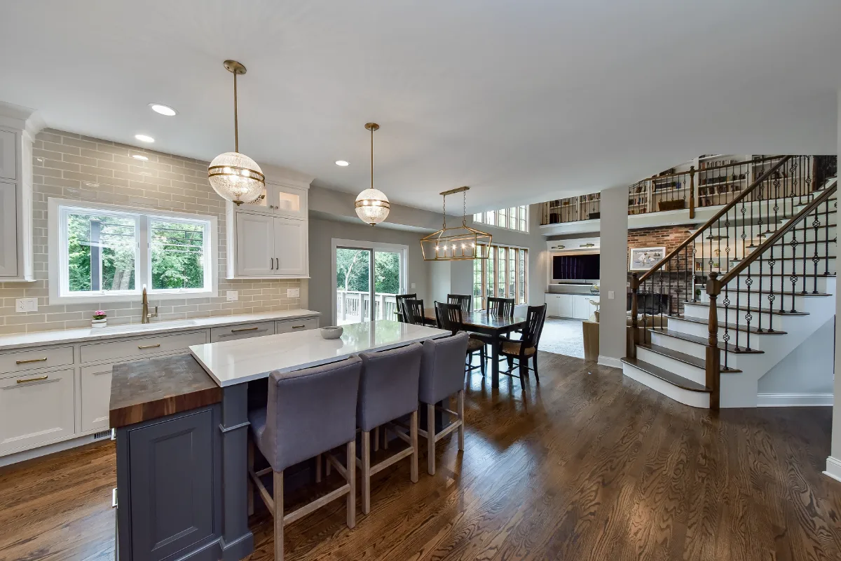 A transitional-warm kitchen in Brentwood, TN. CWP Snowbound and Urban Bronze Beaded Inset cabinetry, Orion Calacatta Aria quartz, Black Walnut end-grain island top, and Sonoma Stellar Metro Gray backsplash by Sebring Design Build.
