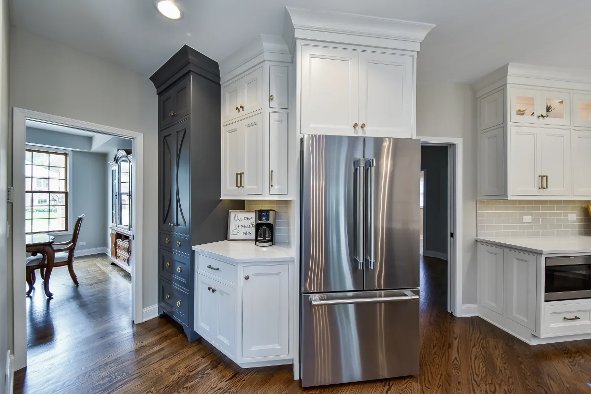 A transitional-warm kitchen in Brentwood, TN. CWP Snowbound and Urban Bronze Beaded Inset cabinetry, Orion Calacatta Aria quartz, Black Walnut end-grain island top, and Sonoma Stellar Metro Gray backsplash by Sebring Design Build.