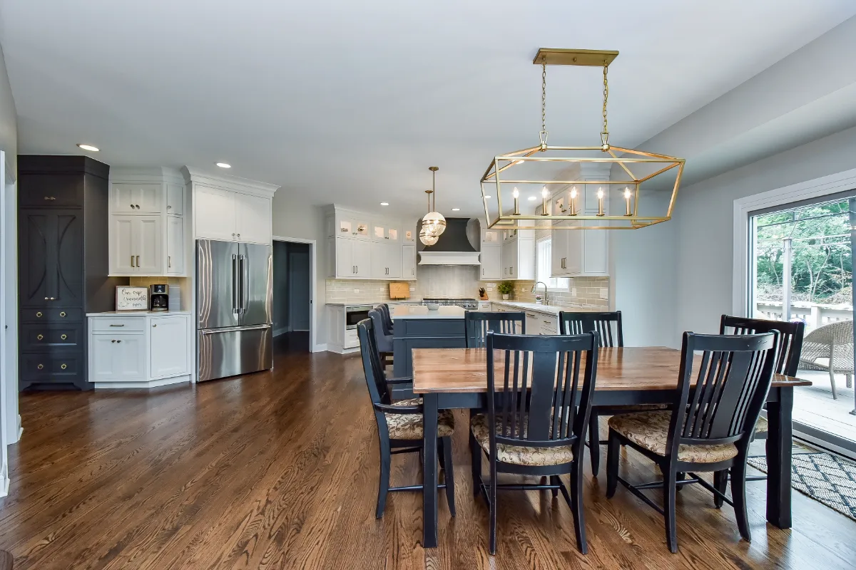 A transitional-warm kitchen in Brentwood, TN. CWP Snowbound and Urban Bronze Beaded Inset cabinetry, Orion Calacatta Aria quartz, Black Walnut end-grain island top, and Sonoma Stellar Metro Gray backsplash by Sebring Design Build.