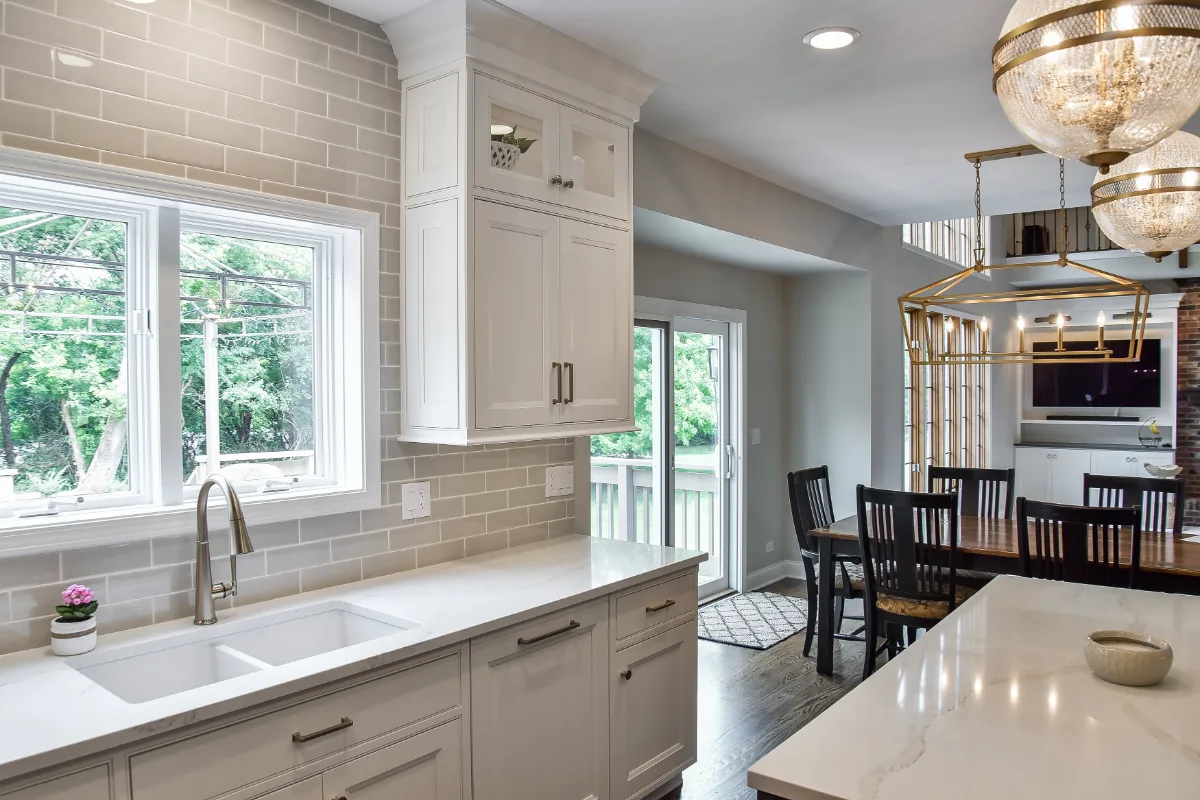 A transitional-warm kitchen in Brentwood, TN. CWP Snowbound and Urban Bronze Beaded Inset cabinetry, Orion Calacatta Aria quartz, Black Walnut end-grain island top, and Sonoma Stellar Metro Gray backsplash by Sebring Design Build.
