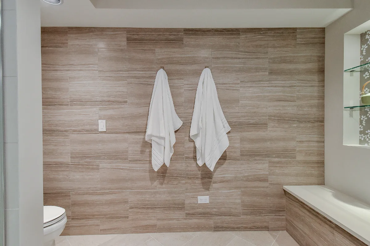 Guest Bath remodel in Franklin, TN. Sebring Design Build designed this Franklin basement guest bath with Maple Standard Slab cabinetry, Hanstone Chia quartz, an Elkay Revere sink, Moen Voss Chrome faucet.
