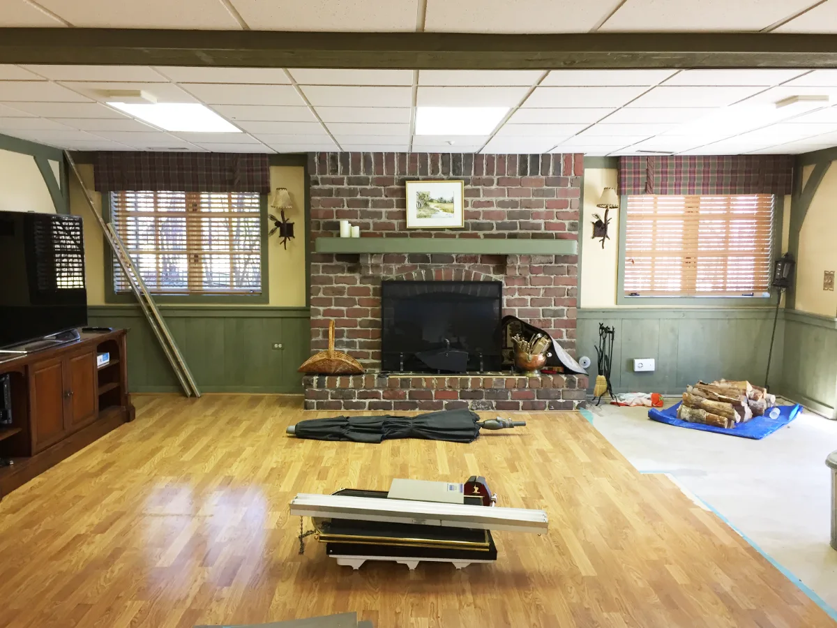 A functional-modern basement remodel in Franklin, TN with gym, guest bath, wet bar, and workshop zones. Porcelain tile entry, rubber gym flooring, and Cambria Devon quartz by Sebring Design Build.