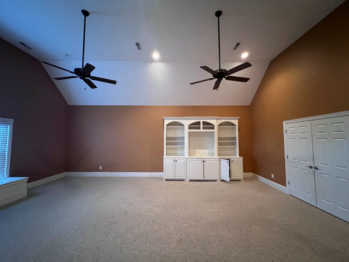 A modern-elegant loft in Watkins Creek, Franklin TN 37067. River Rock and Champagne cabinetry, Duchateau Guild Kayla prefinished hardwood, and Honey Bronze Top Knobs hardware by Sebring Design Build.