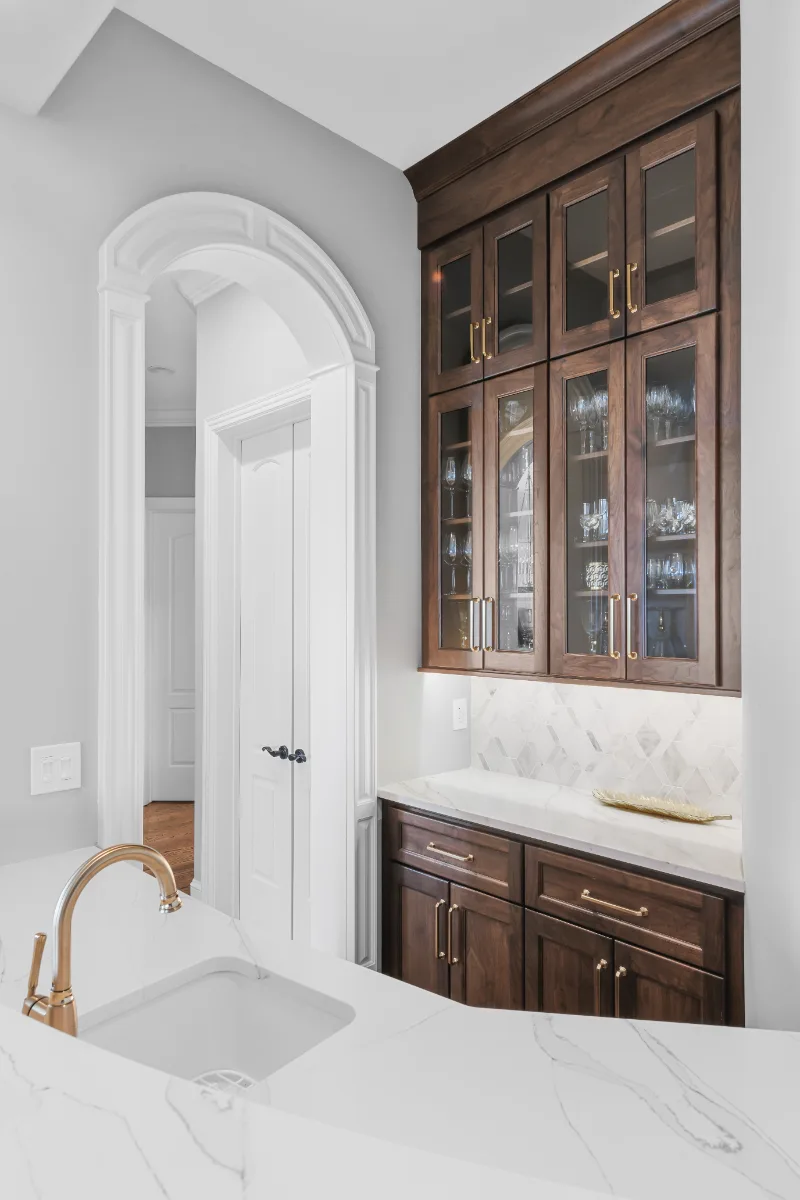 Kitchen remodel in Governors Club, Brentwood TN. Elegant, light palette with custom cabinetry and stone countertops by Sebring Design Build.