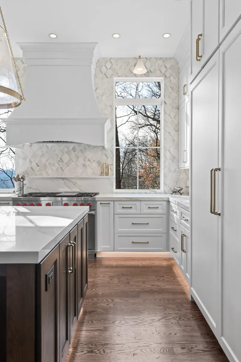 Kitchen remodel in Governors Club, Brentwood TN. Elegant, light palette with custom cabinetry and stone countertops by Sebring Design Build.
