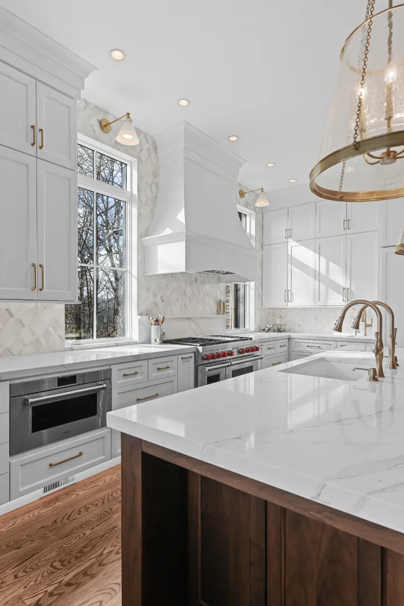 Kitchen remodel in Governors Club, Brentwood TN. Elegant, light palette with custom cabinetry and stone countertops by Sebring Design Build.