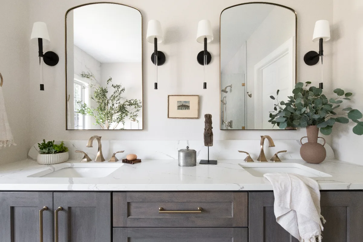 A coastal-elegant primary bath remodel in Willowsprings, Franklin TN 37064. Alder cabinetry, Calacatta Gold quartz, and Kohler Champagne Bronze by Sebring Design Build.
