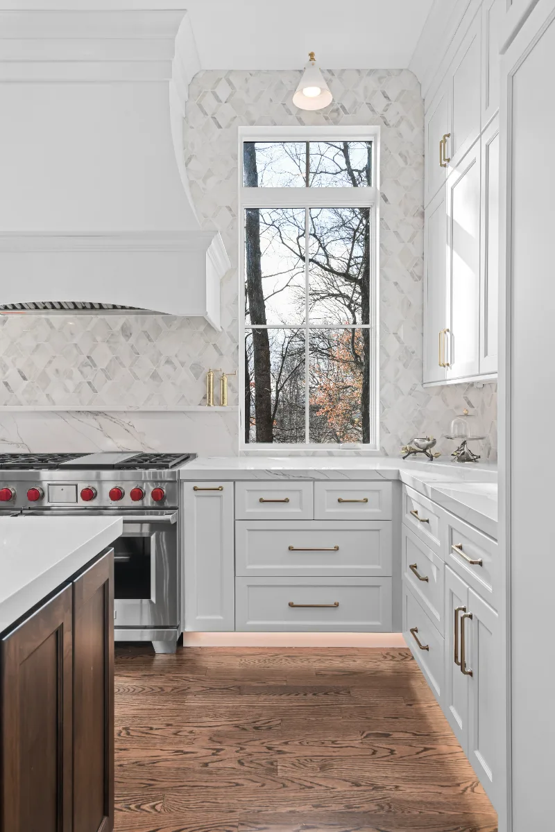 Kitchen remodel in Governors Club, Brentwood TN. Elegant, light palette with custom cabinetry and stone countertops by Sebring Design Build.