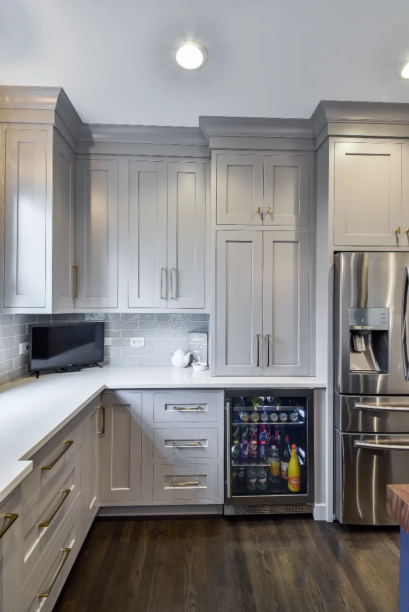 Two-tone kitchen remodel in Franklin, TN with metropolitan style and balanced design. Functional and refined by Sebring Design Build.