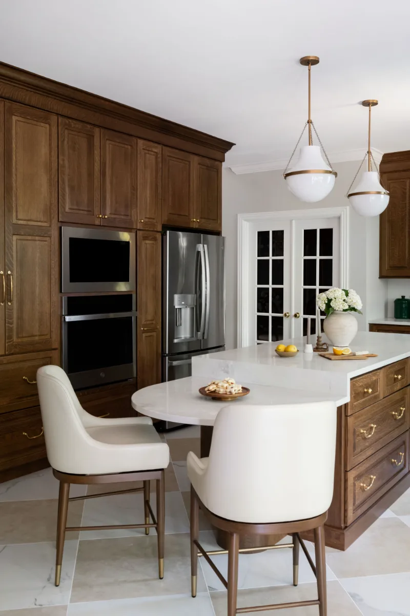 A transitional-heritage kitchen remodel in Chenoweth, Brentwood TN 37027. CWP White Oak Coffee cabinetry, MSI Calcutta Versailles quartz, Davoli French Gold faucet, custom brass hood, and Leona Checkerboard flooring by Sebring Design Build.