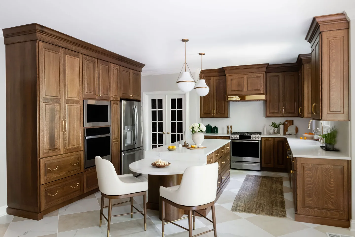 A transitional-heritage kitchen remodel in Chenoweth, Brentwood TN 37027. CWP White Oak Coffee cabinetry, MSI Calcutta Versailles quartz, Davoli French Gold faucet, custom brass hood, and Leona Checkerboard flooring by Sebring Design Build.