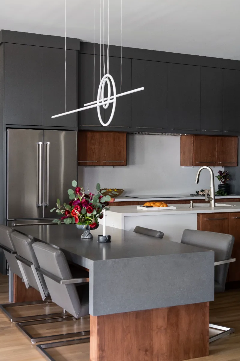 A contemporary-unique whole home remodel in Westhaven, Franklin TN 37064. Six spaces with Alder Nutmeg cabinetry, Mikado leathered quartz, Hansgrohe Matte Black fixtures, and bold fireplace tile by Sebring Design Build.