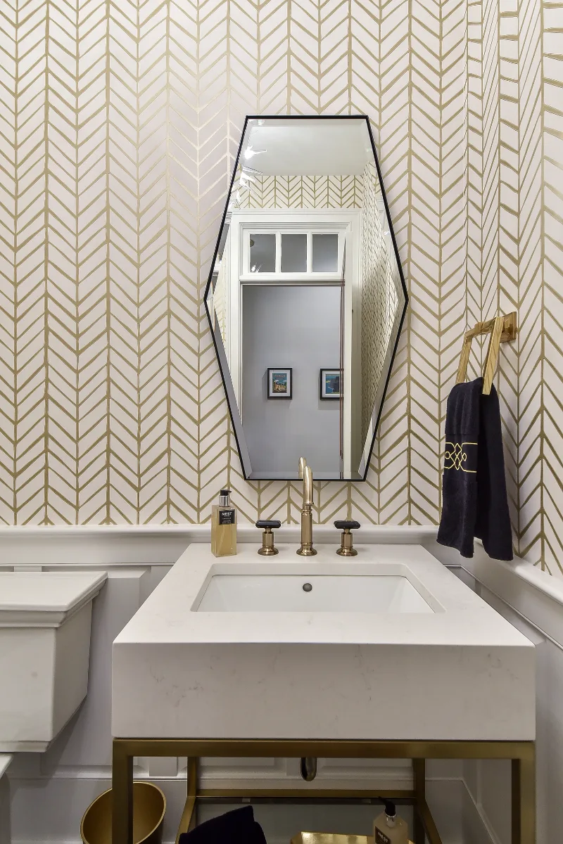 A transitional-elegant multi-room remodel in Brentwood, TN. Grand kitchen with CWP Fawn Brindle cabinetry, CaesarStone Statuario Nuvo, Kohler Artifacts Polished Nickel, and a brass powder room showstopper by Sebring Design Build.