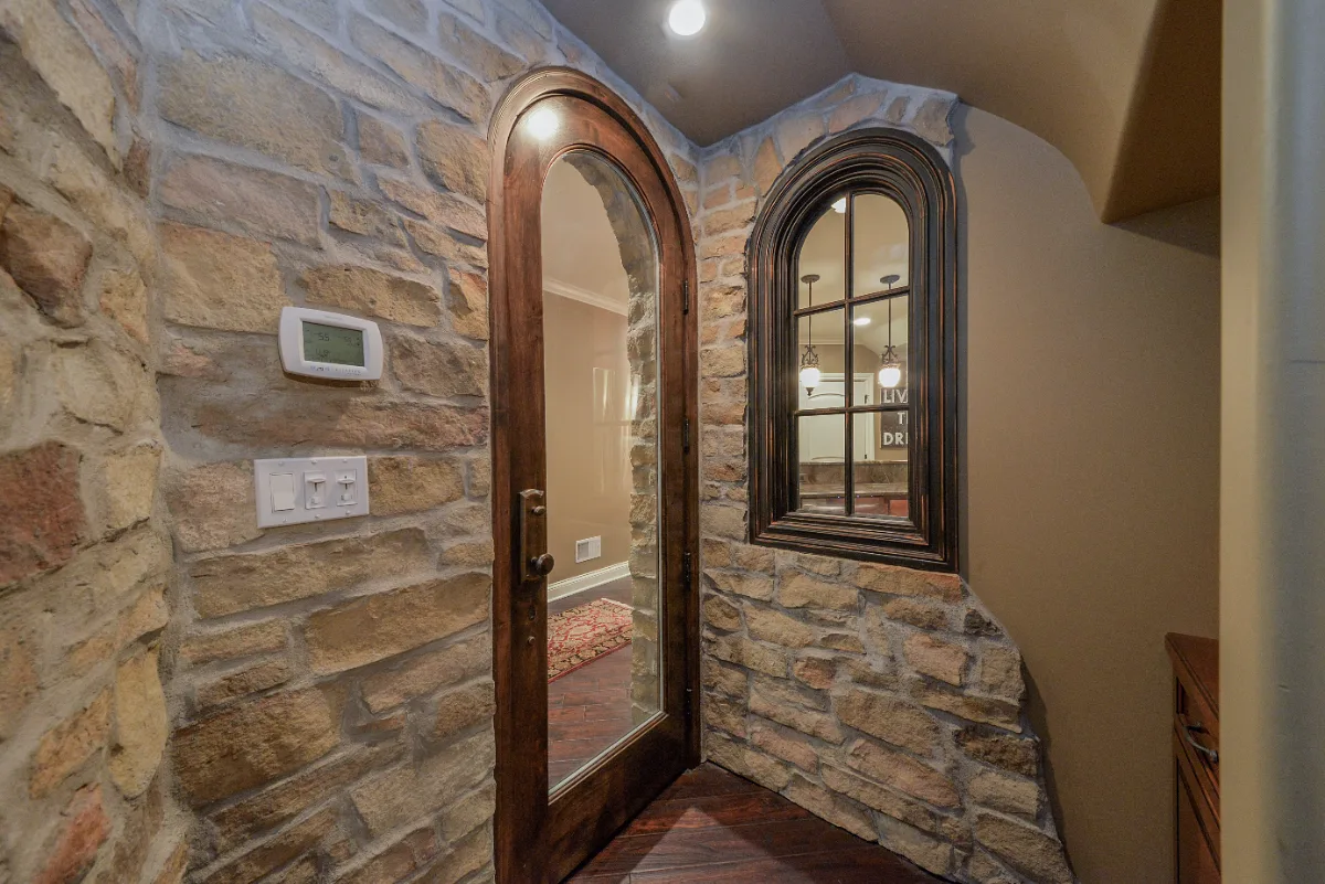 A unique-traditional basement remodel in Franklin, TN with a home theater, wine cellar, bar, and gym by Sebring Design Build.