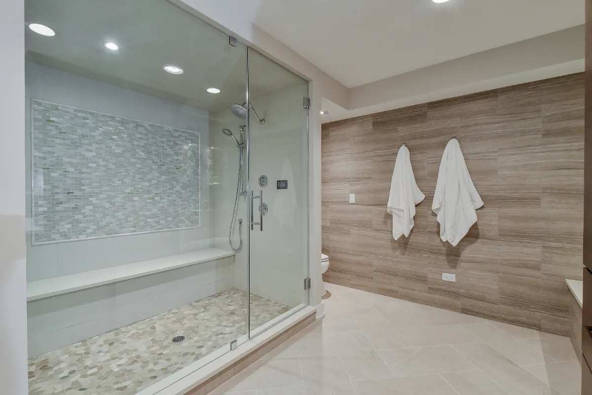Guest Bath remodel in Franklin, TN. Sebring Design Build designed this Franklin basement guest bath with Maple Standard Slab cabinetry, Hanstone Chia quartz, an Elkay Revere sink, Moen Voss Chrome faucet.