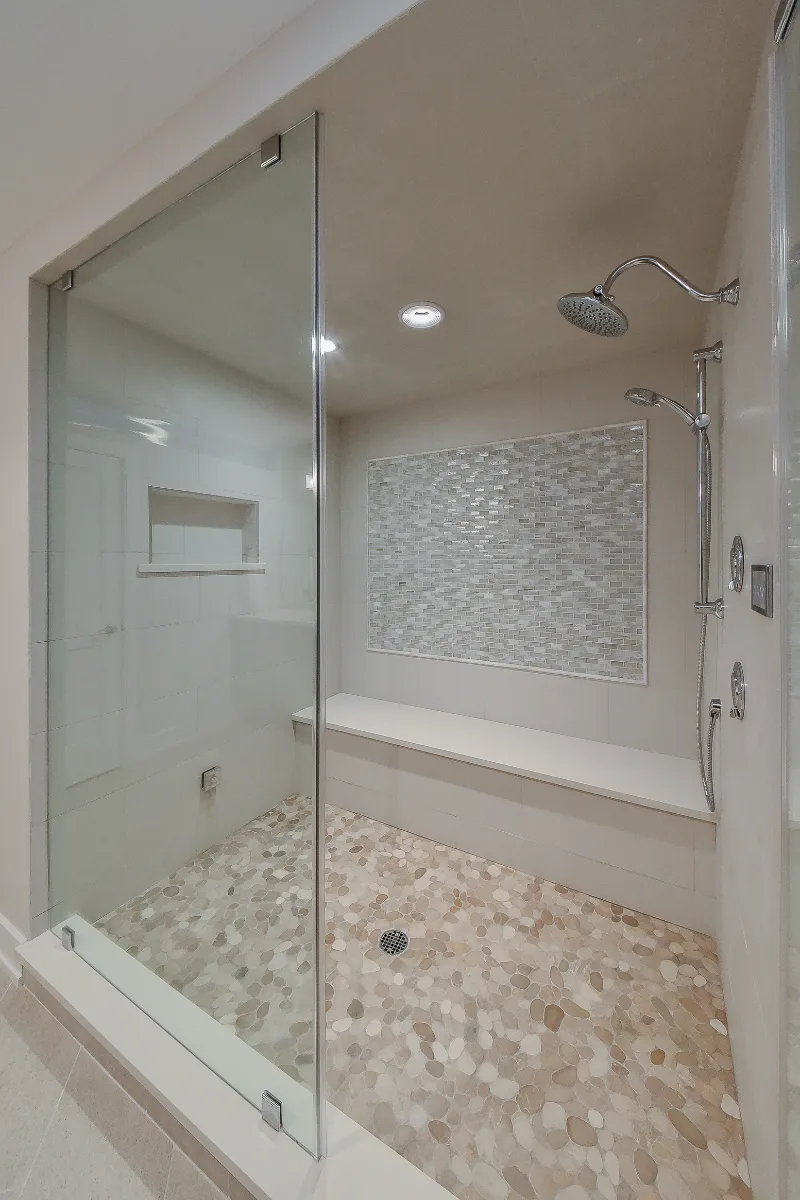 Guest Bath remodel in Franklin, TN. Sebring Design Build designed this Franklin basement guest bath with Maple Standard Slab cabinetry, Hanstone Chia quartz, an Elkay Revere sink, Moen Voss Chrome faucet.