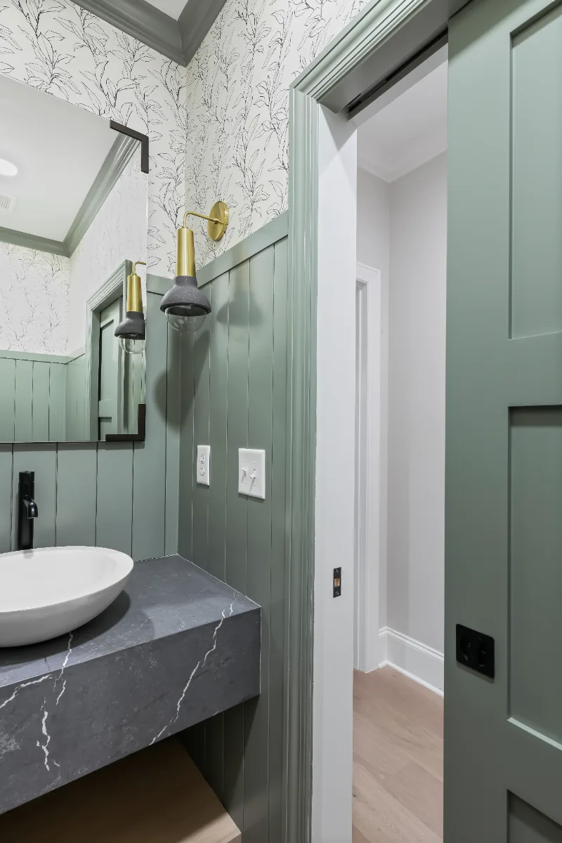 Powder Room remodel in Watkins Creek, TN. Sebring Design Build created this Watkins Creek powder room in Franklin, Tennessee as a room with genuine personality: Ripe Olive and Champagne stain cabinetry, Mikado Cemento quartz.