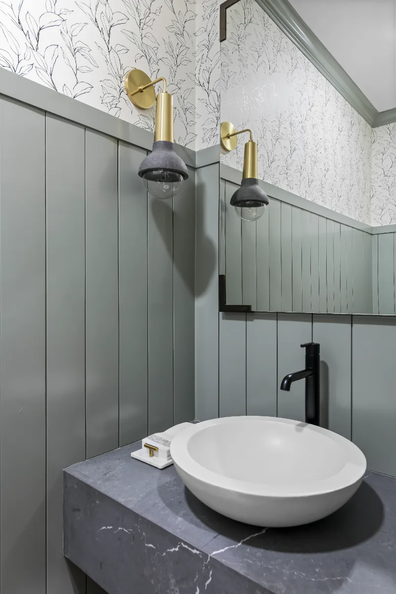Powder Room remodel in Watkins Creek, TN. Sebring Design Build created this Watkins Creek powder room in Franklin, Tennessee as a room with genuine personality: Ripe Olive and Champagne stain cabinetry, Mikado Cemento quartz.