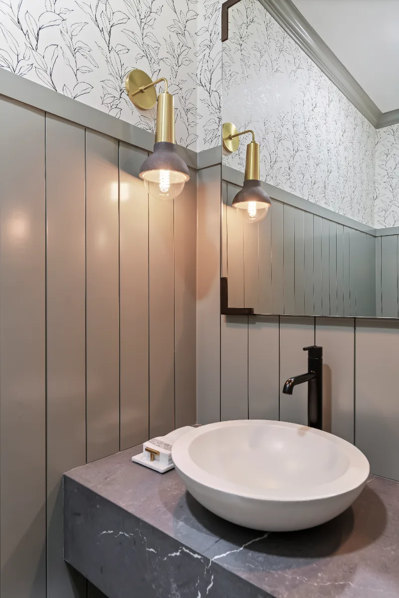 Powder Room remodel in Watkins Creek, TN. Sebring Design Build created this Watkins Creek powder room in Franklin, Tennessee as a room with genuine personality: Ripe Olive and Champagne stain cabinetry, Mikado Cemento quartz.
