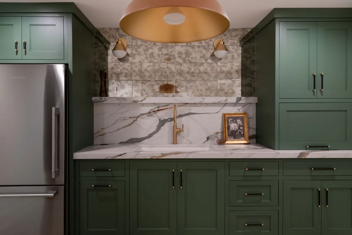 A modern-functional basement remodel in Bonbrook, Brentwood TN 37027. Media room, guest bath, kitchenette, and bar transformed with custom cabinetry and Kilimanjaro quartz by Sebring Design Build.