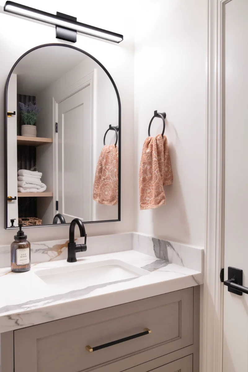 Guest Bath remodel in Franklin, TN. Sebring Design Build designed this Bonbrook basement guest bath in Brentwood, Tennessee with a modern-functional tile program featuring Kenridge Ribbon Maple shower walls.