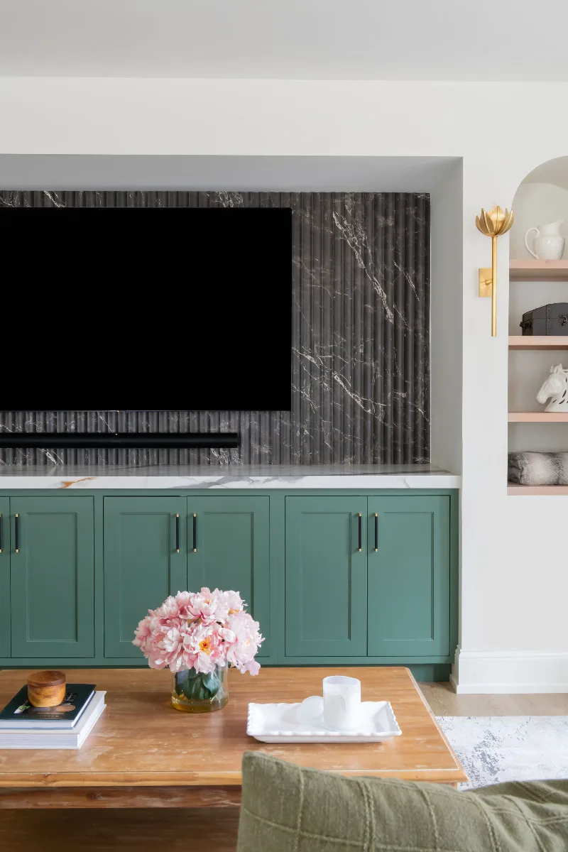 A modern-functional basement remodel in Bonbrook, Brentwood TN 37027. Custom SW Basil media wall cabinetry, Kilimanjaro quartz, acoustic wood slat panels, and LVP flooring by Sebring Design Build.