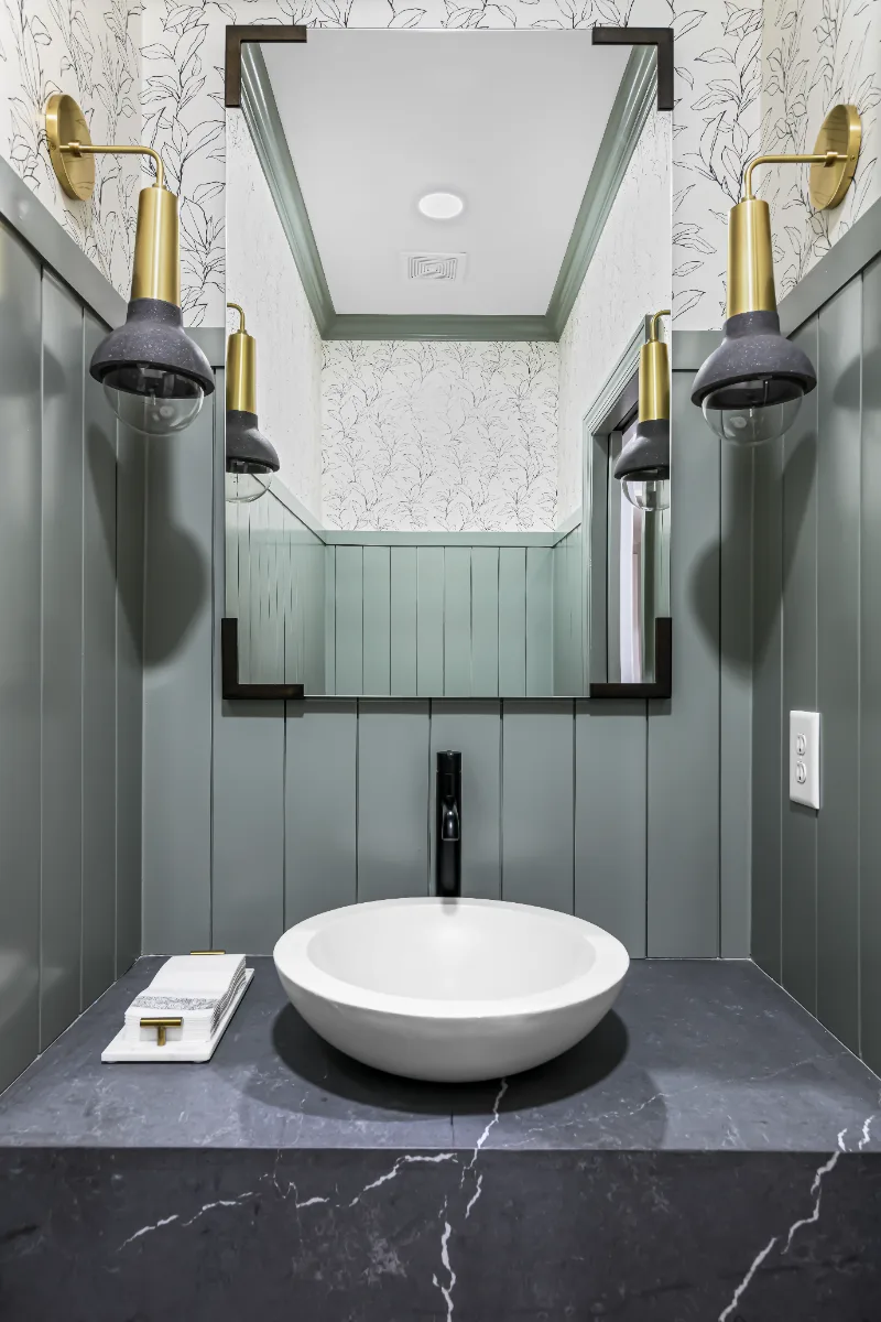 Powder Room remodel in Watkins Creek, TN. Sebring Design Build created this Watkins Creek powder room in Franklin, Tennessee as a room with genuine personality: Ripe Olive and Champagne stain cabinetry, Mikado Cemento quartz.