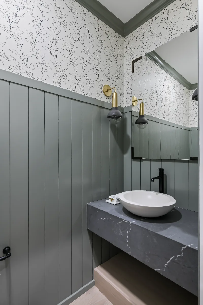 Powder Room remodel in Watkins Creek, TN. Sebring Design Build created this Watkins Creek powder room in Franklin, Tennessee as a room with genuine personality: Ripe Olive and Champagne stain cabinetry, Mikado Cemento quartz.