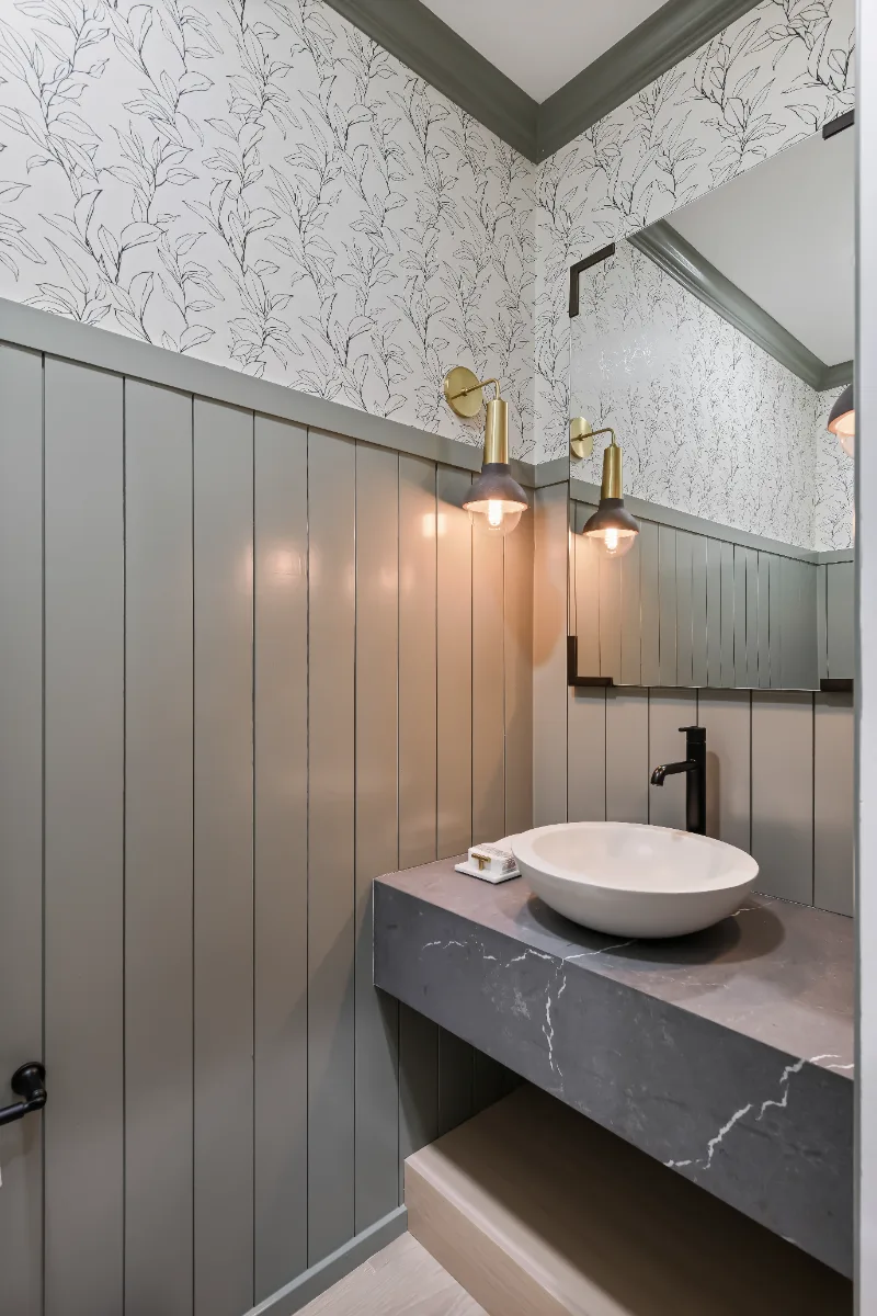Powder Room remodel in Watkins Creek, TN. Sebring Design Build created this Watkins Creek powder room in Franklin, Tennessee as a room with genuine personality: Ripe Olive and Champagne stain cabinetry, Mikado Cemento quartz.