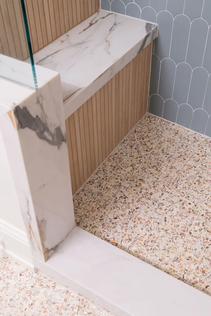 Guest Bath remodel in Franklin, TN. Sebring Design Build designed this Bonbrook basement guest bath in Brentwood, Tennessee with a modern-functional tile program featuring Kenridge Ribbon Maple shower walls.