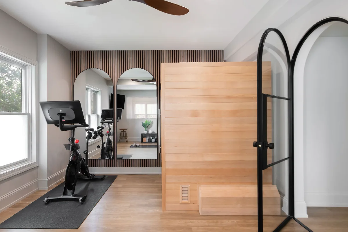 A modern-functional basement remodel in Bonbrook, Brentwood TN 37027. Custom SW Basil media wall cabinetry, Kilimanjaro quartz, acoustic wood slat panels, and LVP flooring by Sebring Design Build.