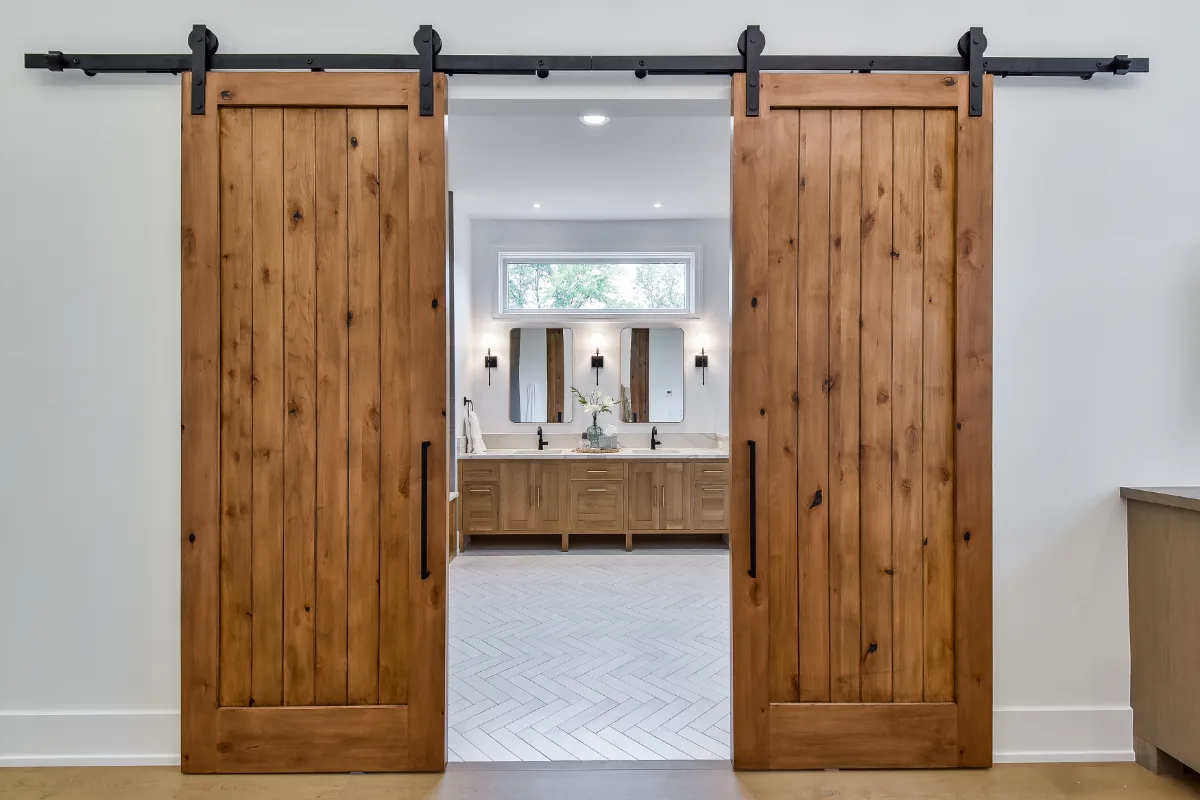 A transitional-elegant primary bath remodel in Franklin, TN. White Oak Sage cabinetry, Cambria Brittanicca Warm quartz, MTI Andrea soaking tub, and Dolomiti tile by Sebring Design Build.