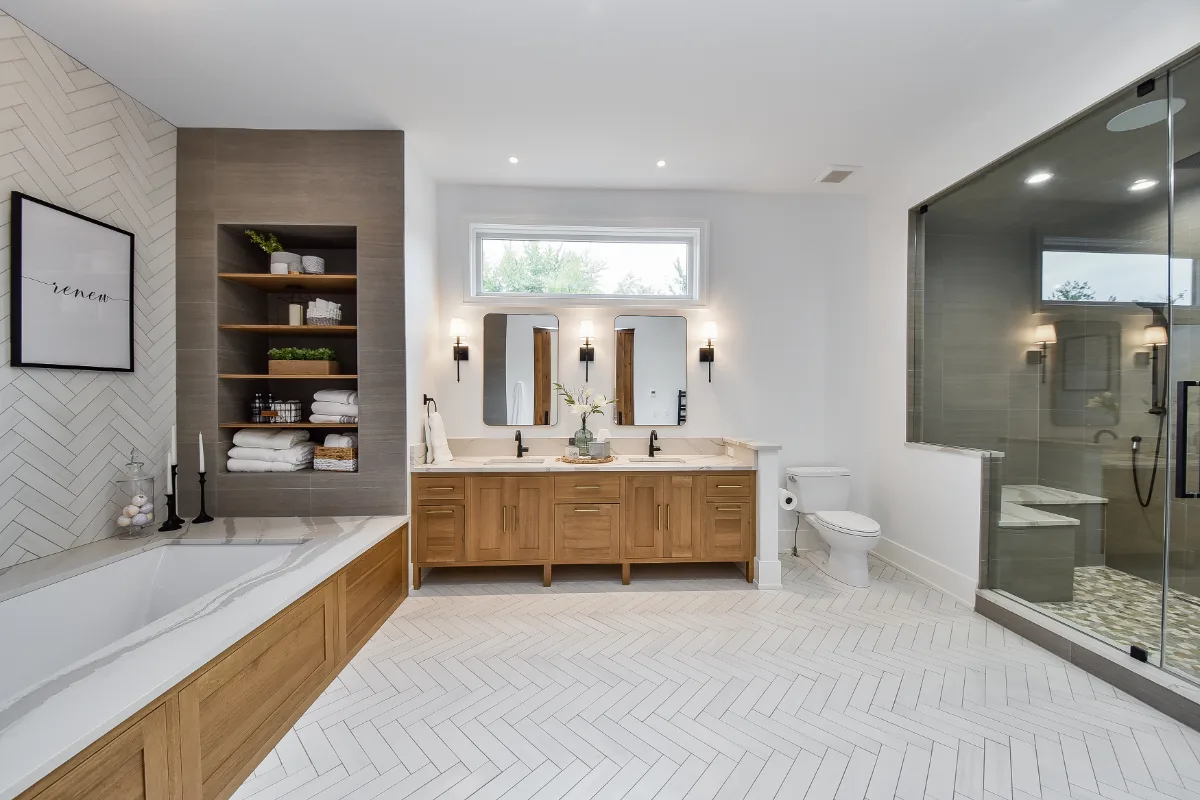 Primary Bath remodel in Franklin, TN. Sebring Design Build transformed this Franklin, Tennessee primary bath into a warm, elegant retreat with Metro Recessed White Oak cabinetry in Sage, Cambria Brittanicca Warm quartz.