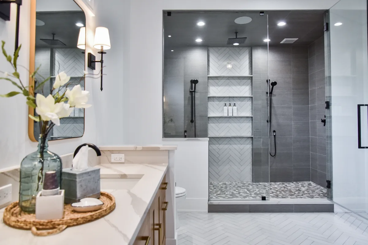 A transitional-elegant whole-home remodel in Franklin, TN. White Oak cabinetry in Sage, Cambria Brittanicca Warm quartz, and Delta Matte Black fixtures by Sebring Design Build.