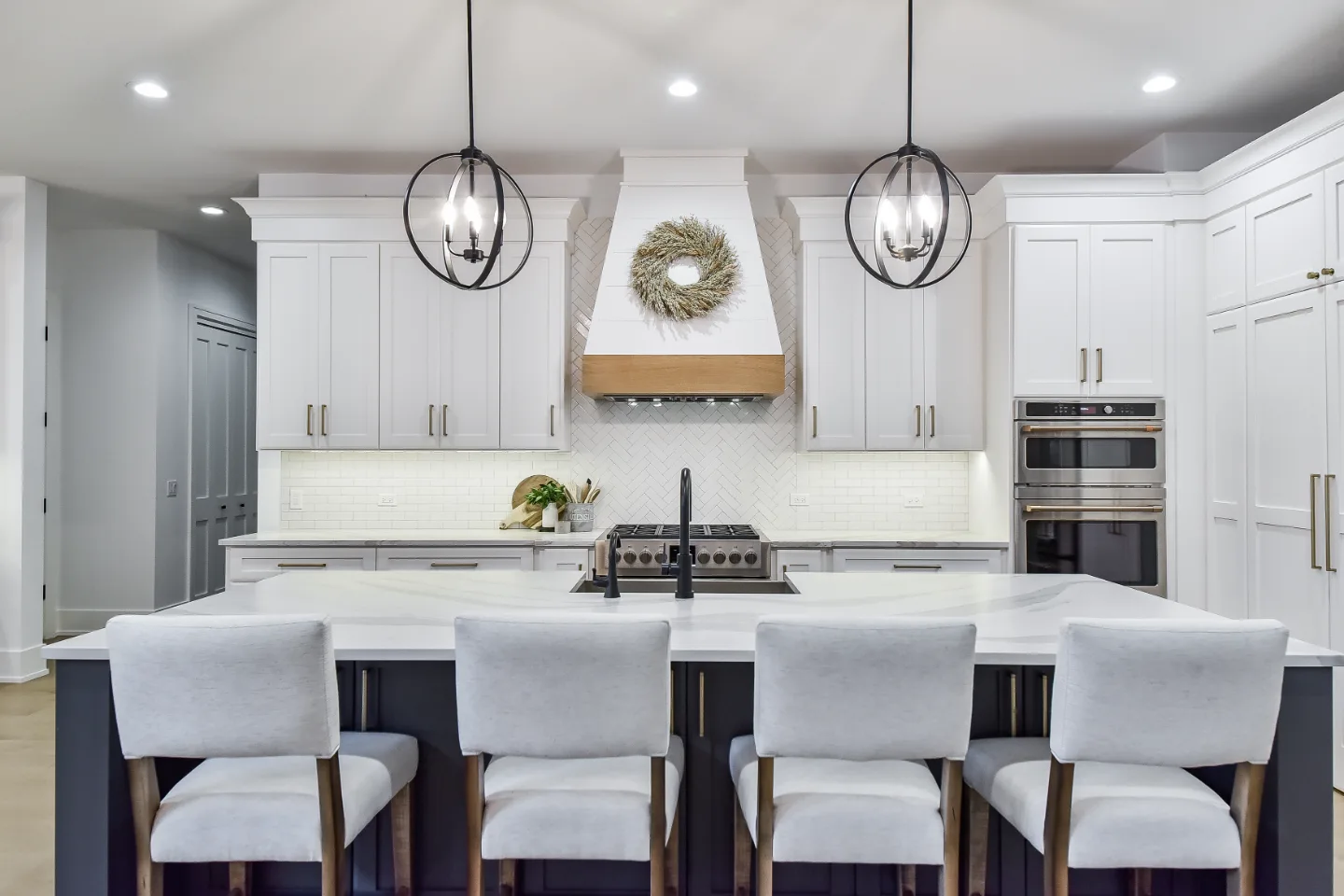 A transitional-elegant kitchen remodel in Franklin, TN. Snowbound and White Oak Sage cabinetry, Cambria Brittanicca Warm Matte quartz, and Zellige tile backsplash by Sebring Design Build.
