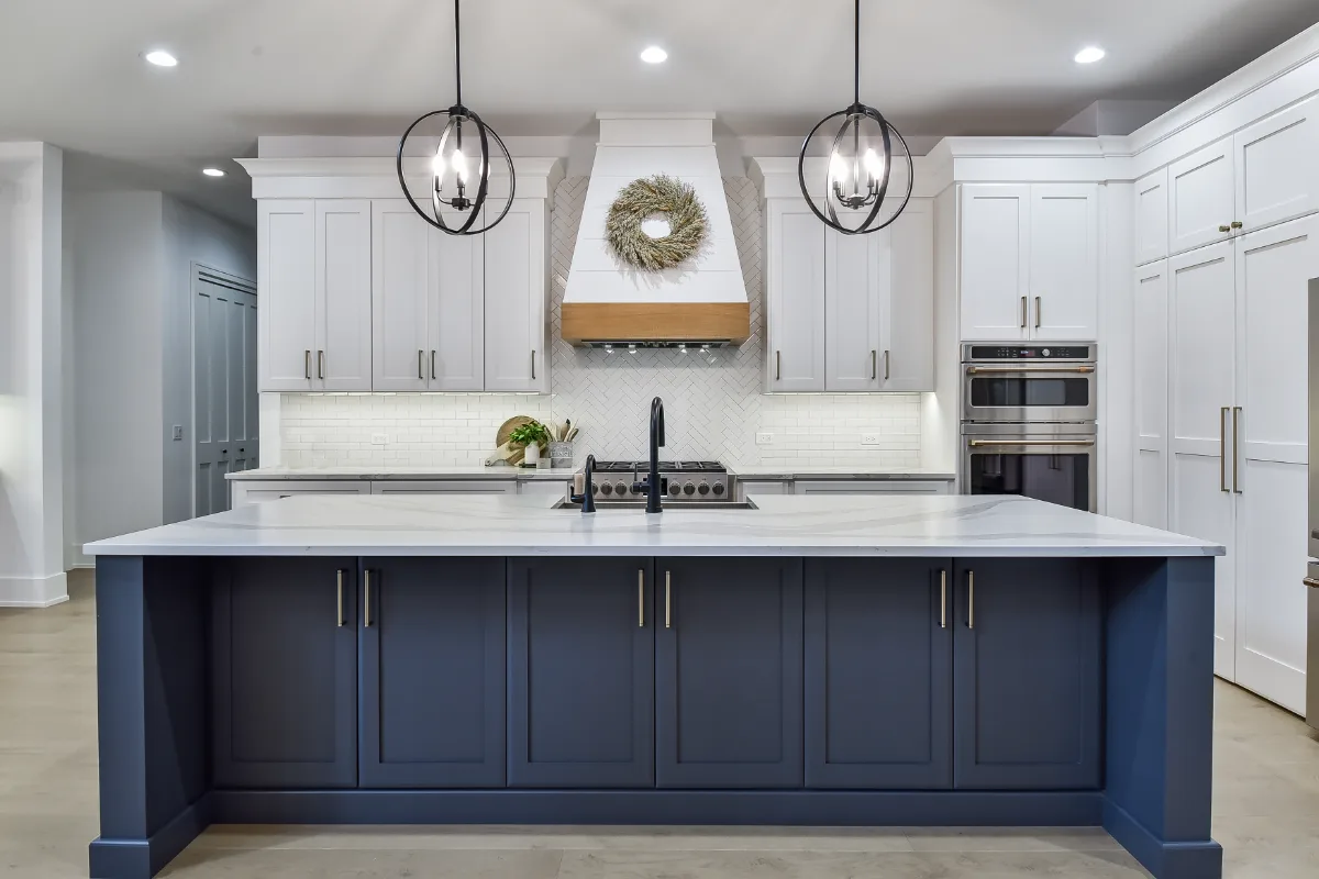 A transitional-elegant kitchen remodel in Franklin, TN. Snowbound and White Oak Sage cabinetry, Cambria Brittanicca Warm Matte quartz, and Zellige tile backsplash by Sebring Design Build.