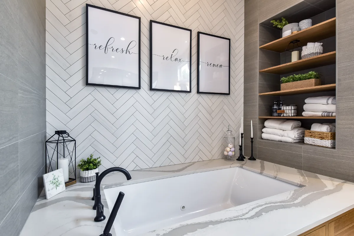 A transitional-elegant primary bath remodel in Franklin, TN. White Oak Sage cabinetry, Cambria Brittanicca Warm quartz, MTI Andrea soaking tub, and Dolomiti tile by Sebring Design Build.