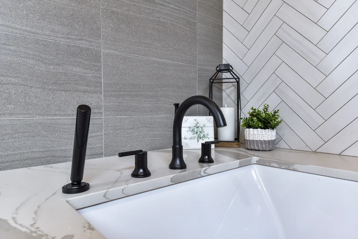 A transitional-elegant primary bath remodel in Franklin, TN. White Oak Sage cabinetry, Cambria Brittanicca Warm quartz, MTI Andrea soaking tub, and Dolomiti tile by Sebring Design Build.