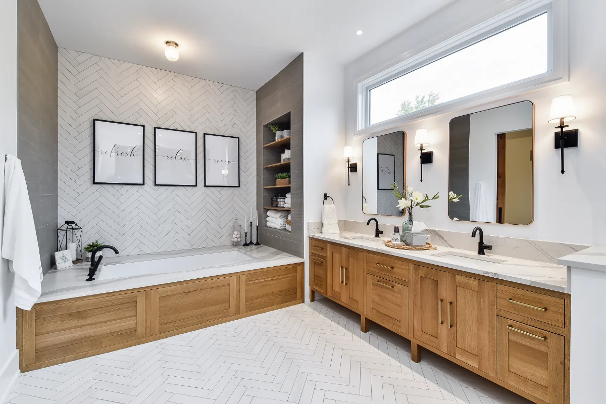 A transitional-elegant primary bath remodel in Franklin, TN. White Oak Sage cabinetry, Cambria Brittanicca Warm quartz, MTI Andrea soaking tub, and Dolomiti tile by Sebring Design Build.
