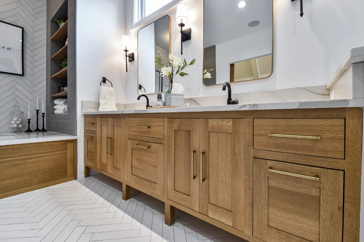A transitional-elegant primary bath remodel in Franklin, TN. White Oak Sage cabinetry, Cambria Brittanicca Warm quartz, MTI Andrea soaking tub, and Dolomiti tile by Sebring Design Build.