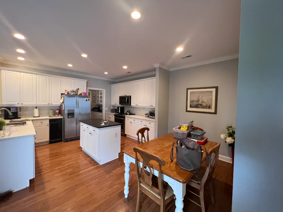 A coastal-elegant kitchen remodel in Willowsprings, Franklin TN 37064. Custom Champagne cabinetry, Calacatta Gold quartz, and Champagne Bronze fixtures by Sebring Design Build.