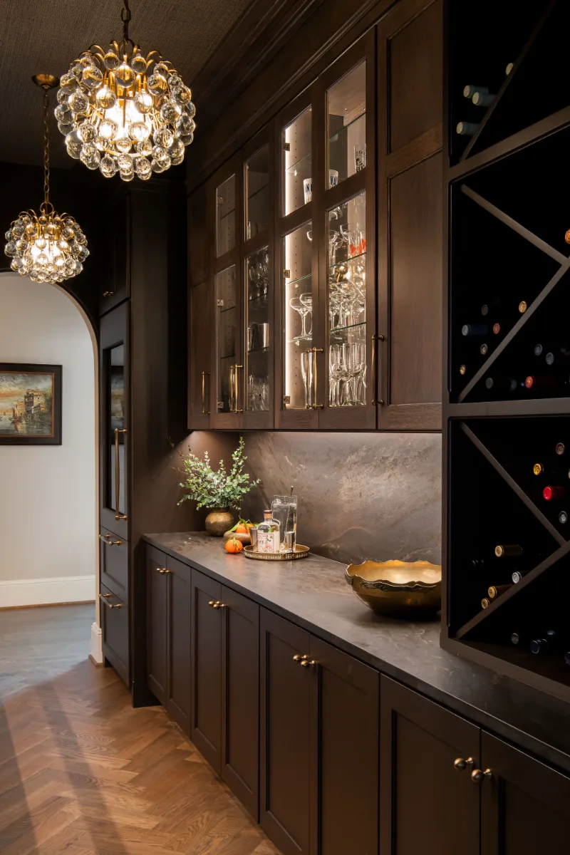 Bar remodel in McGavock Farms, Brentwood. Dark White Oak Rift Sawn cabinetry, antique mirror tile, open shelving, and brass fixtures by Sebring Design Build.