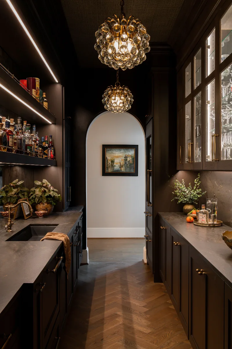 Bar remodel in McGavock Farms, Brentwood. Dark White Oak Rift Sawn cabinetry, antique mirror tile, open shelving, and brass fixtures by Sebring Design Build.
