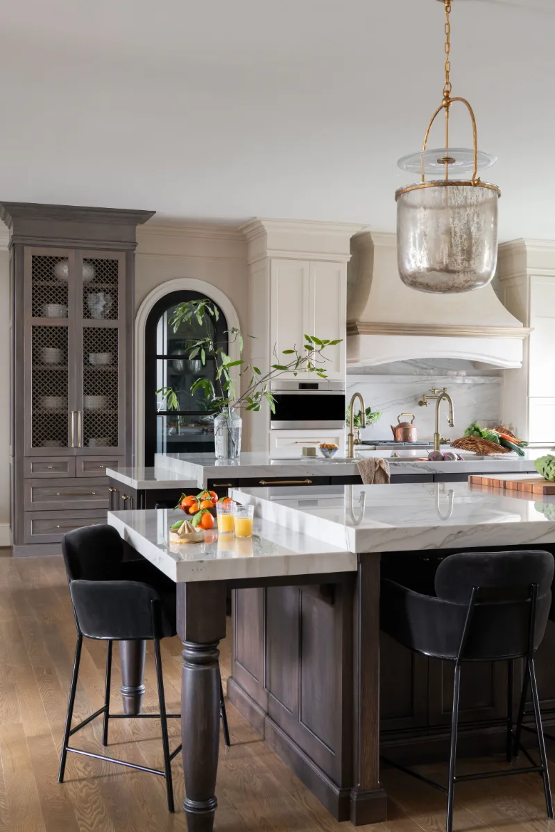 Custom kitchen remodel in McGavock Farms, Brentwood. White oak rift sawn island, Maison Blanche cabinetry, Calacatta quartz, and brass fixtures by Sebring Design Build.