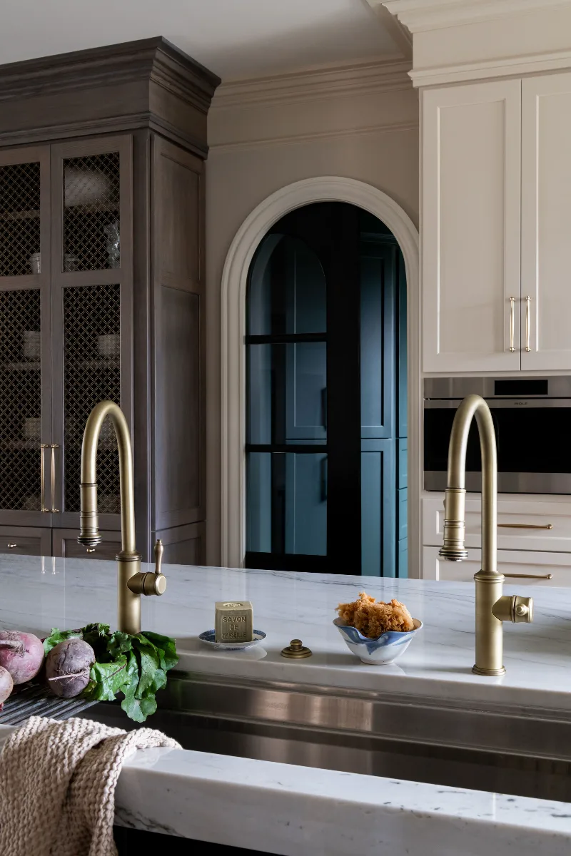 Custom kitchen remodel in McGavock Farms, Brentwood. White oak rift sawn island, Maison Blanche cabinetry, Calacatta quartz, and brass fixtures by Sebring Design Build.