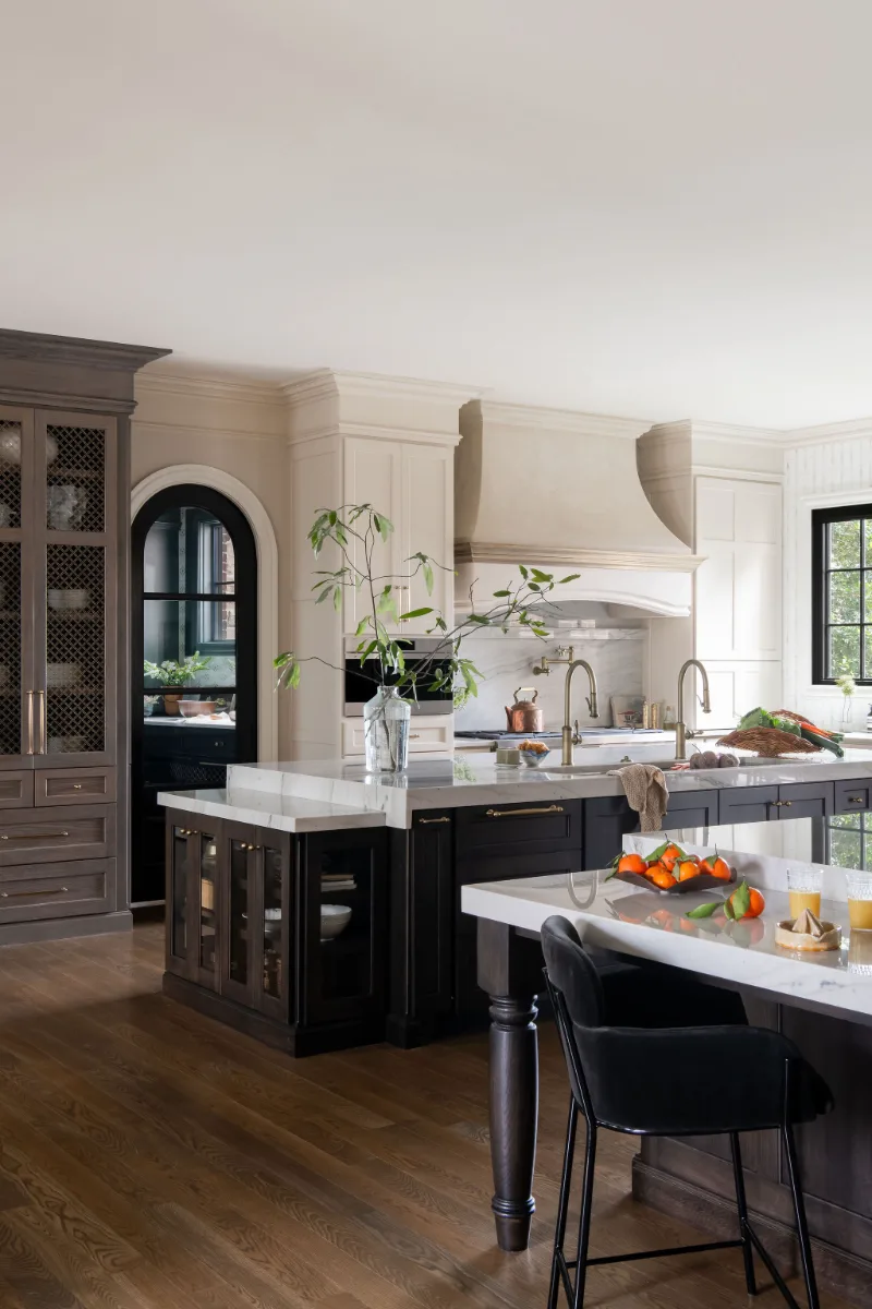 Custom kitchen remodel in McGavock Farms, Brentwood. White oak rift sawn island, Maison Blanche cabinetry, Calacatta quartz, and brass fixtures by Sebring Design Build.