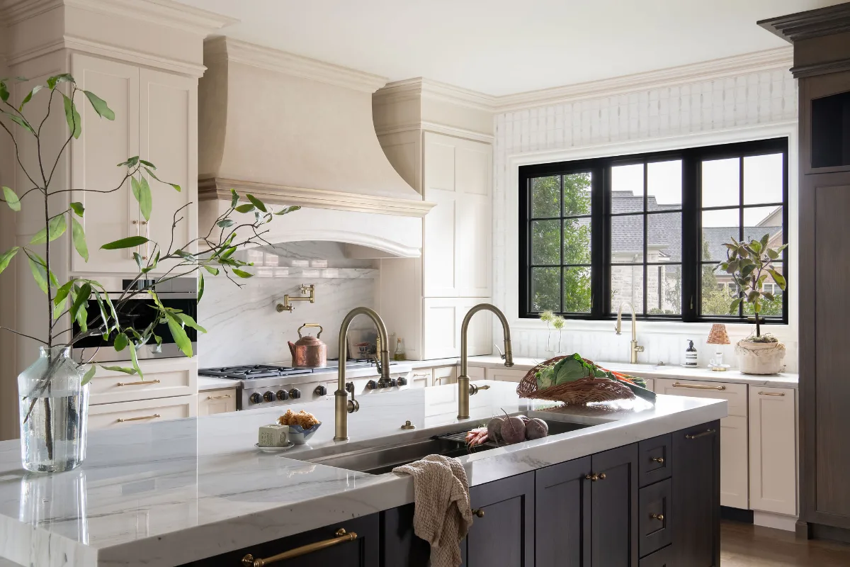 Custom kitchen remodel in McGavock Farms, Brentwood. White oak rift sawn island, Maison Blanche cabinetry, Calacatta quartz, and brass fixtures by Sebring Design Build.