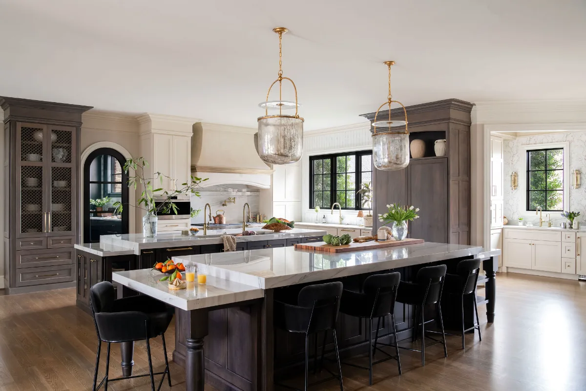 A complete kitchen, butler pantry, bar, and powder room remodel in McGavock Farms, Brentwood. Custom cabinetry, Calacatta quartz, and brass fixtures by Sebring Design Build.